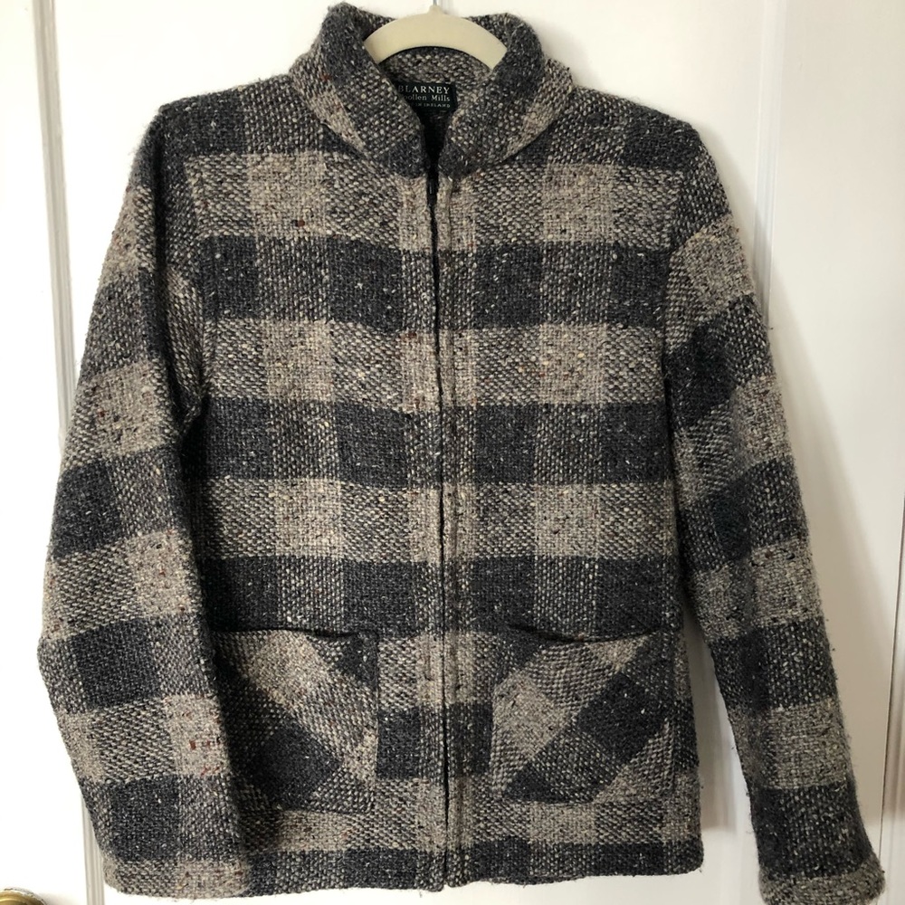 Irish wool sweater with checked print and pockets.